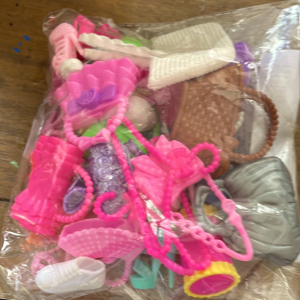 Dollhouse plastic hangers.shoes, bag. Maybe Barbie